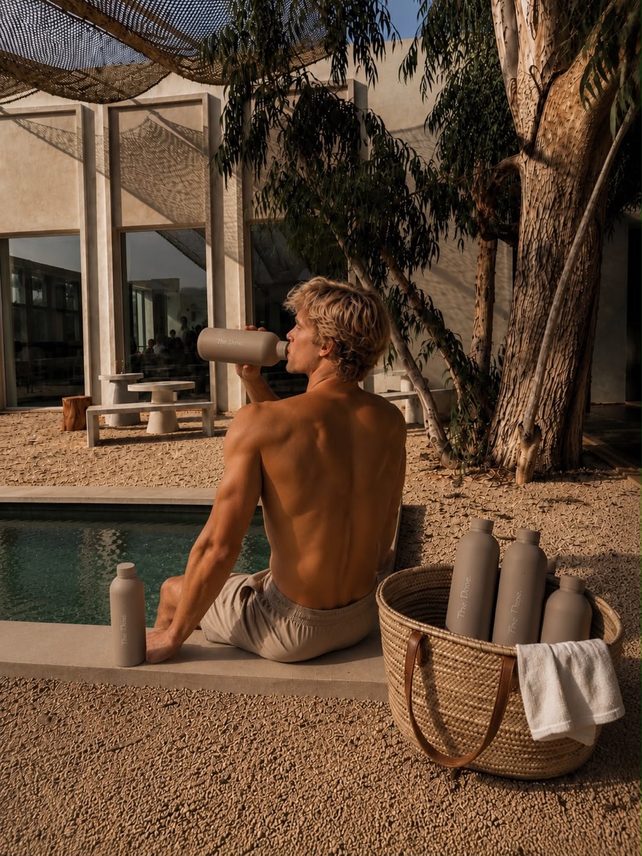 The Dose bottles by the pool